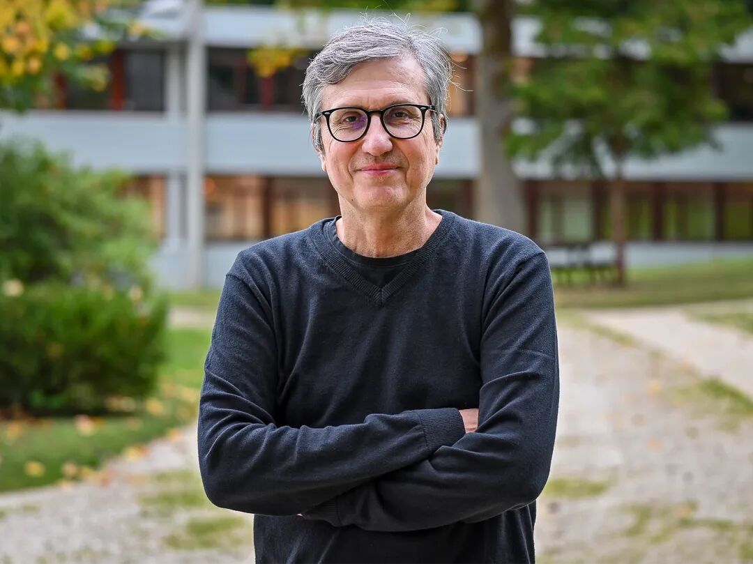 Gray-haired man in glasses.