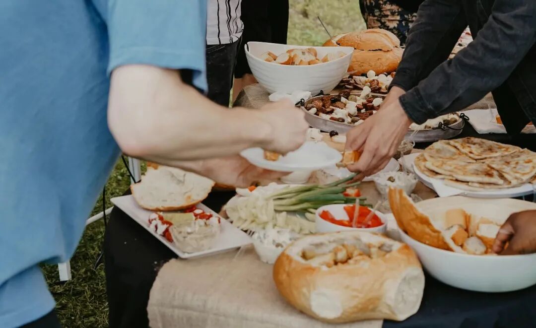 two men grabbing food