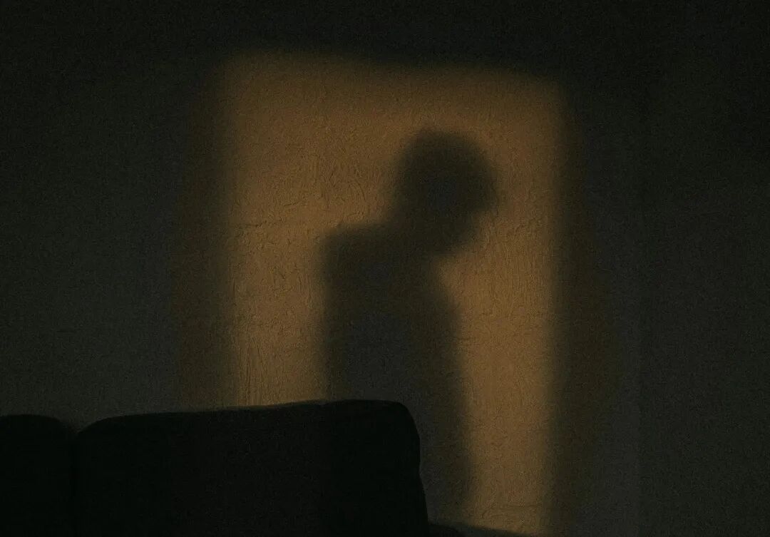 black sofa chair near white wall
