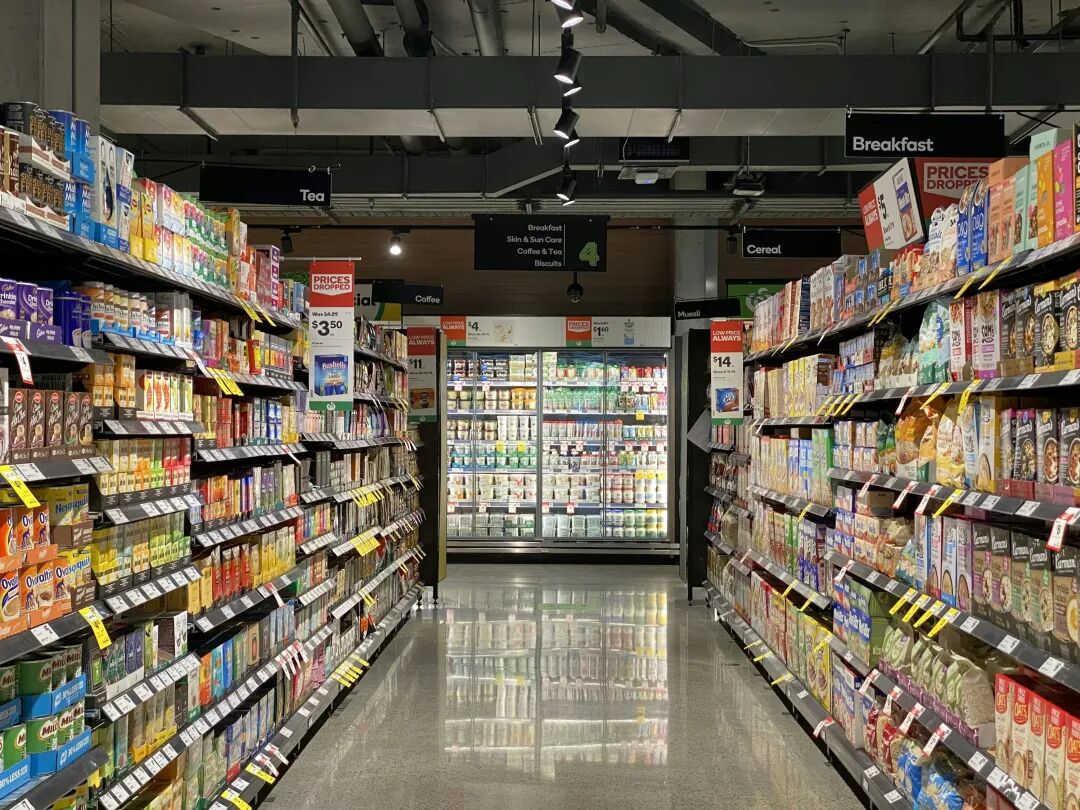 white and red labeled pack on white shelf
