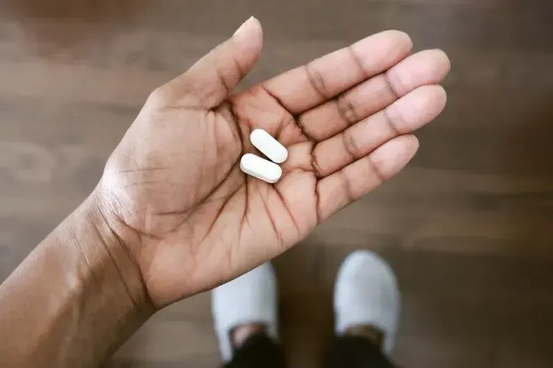 Hand holding tablets