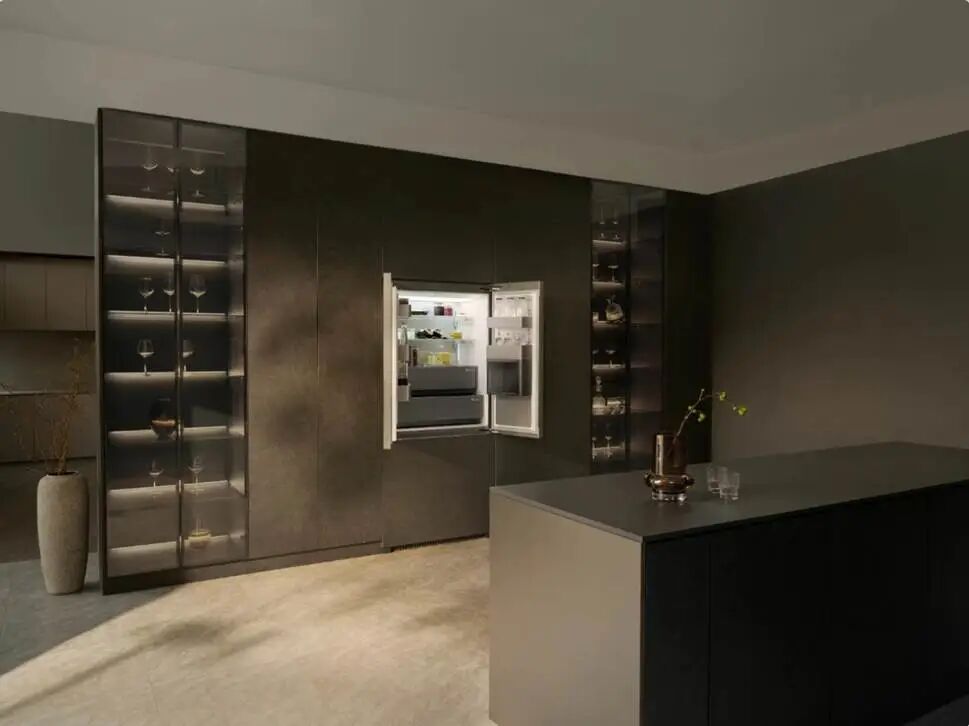 A refrigerator in a dark room Description automatically generated