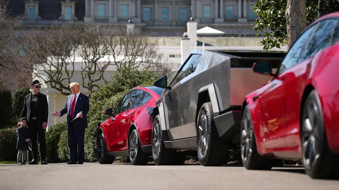 President Donald Trump, joined by White House Senior Advisor, Tesla and SpaceX CEO Elon Musk and his son X Æ A-Xii, delivers remarks next to a Tesla Model Y, a Cyber Truck and a Model S on the South Lawn of the White House on March 11, 2025 in Washington, DC.