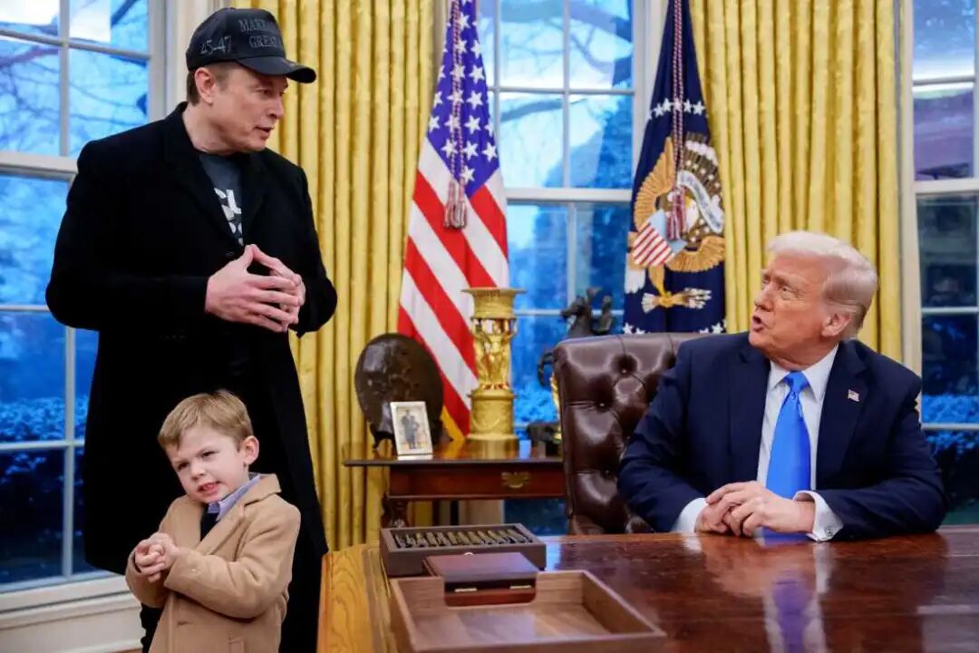 President Trump is joined by Tesla and SpaceX CEO Elon Musk, and his son, X Musk, during an executive order signing in the Oval Office at the White House on Feb. 11, 2025.