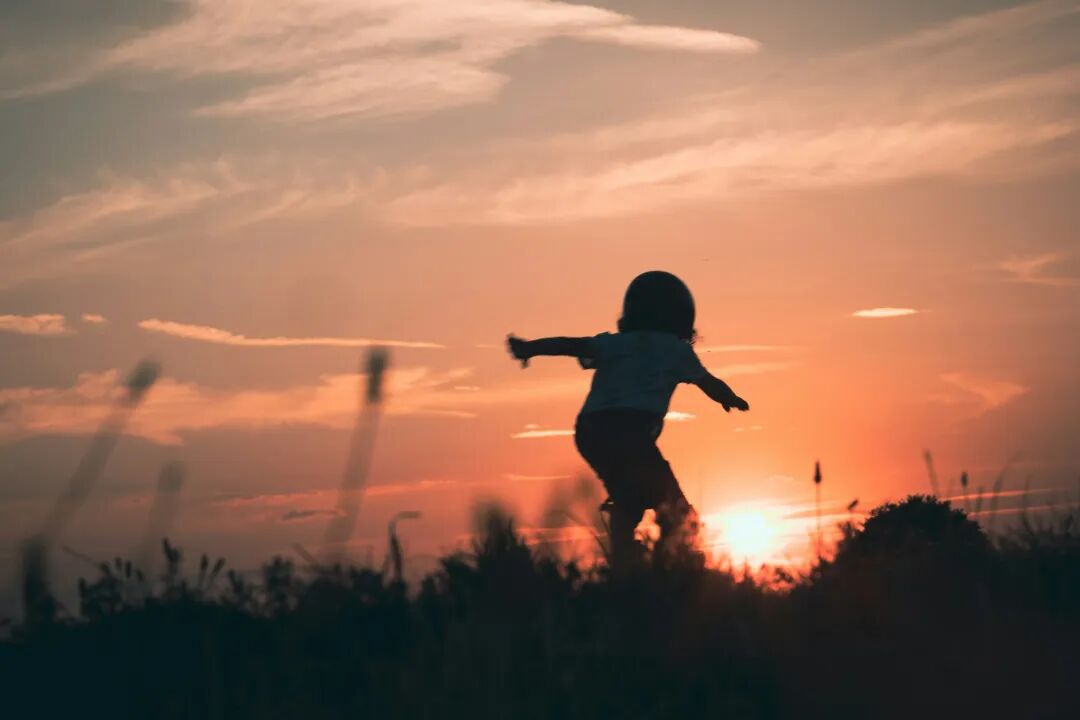 a child jumping in the air