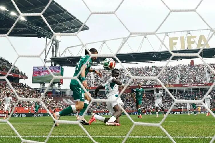 TORONTO, ONTARIO - JUNE 26: (EDITOR'S NOTE: Image was captured using a remote camera from behind the goal.) Ismaila Sarr #18 of Senegal scores his team's second goal during the FIFA World Cup 2026 Group I match between Senegal and Iraq at Toronto Stadium on June 26, 2026 in Toronto, Ontario. (Photo by Michael Reaves/Getty Images)